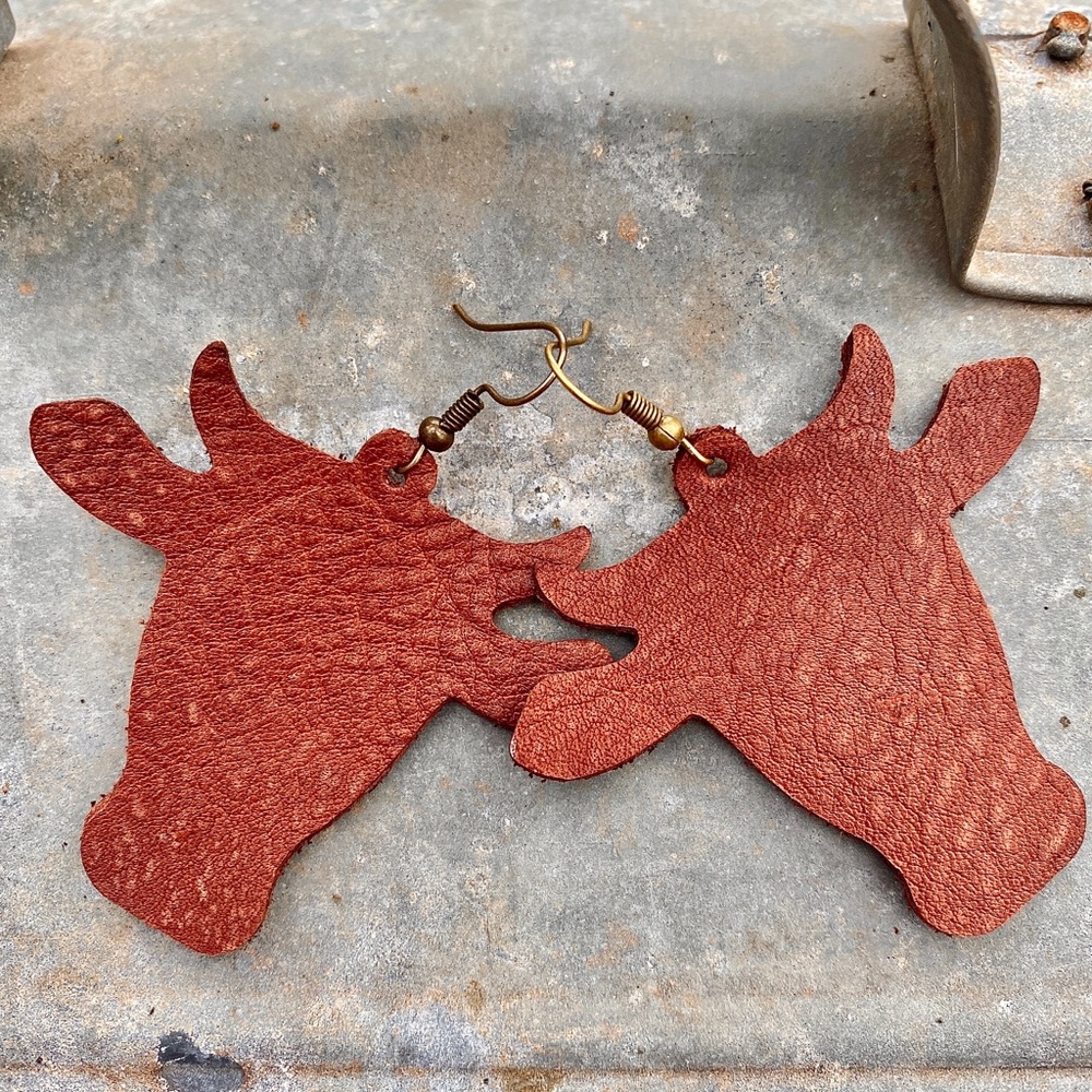 Steer head cow long horn leather earrings.
